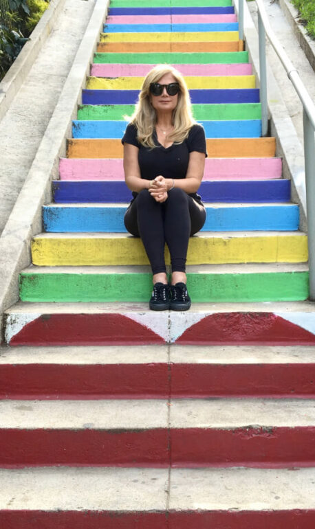 Deborah Kobylt Sitting on Multi-colored Steps