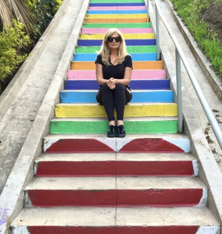 Deborah Kobylt Sitting on Multi-colored Steps